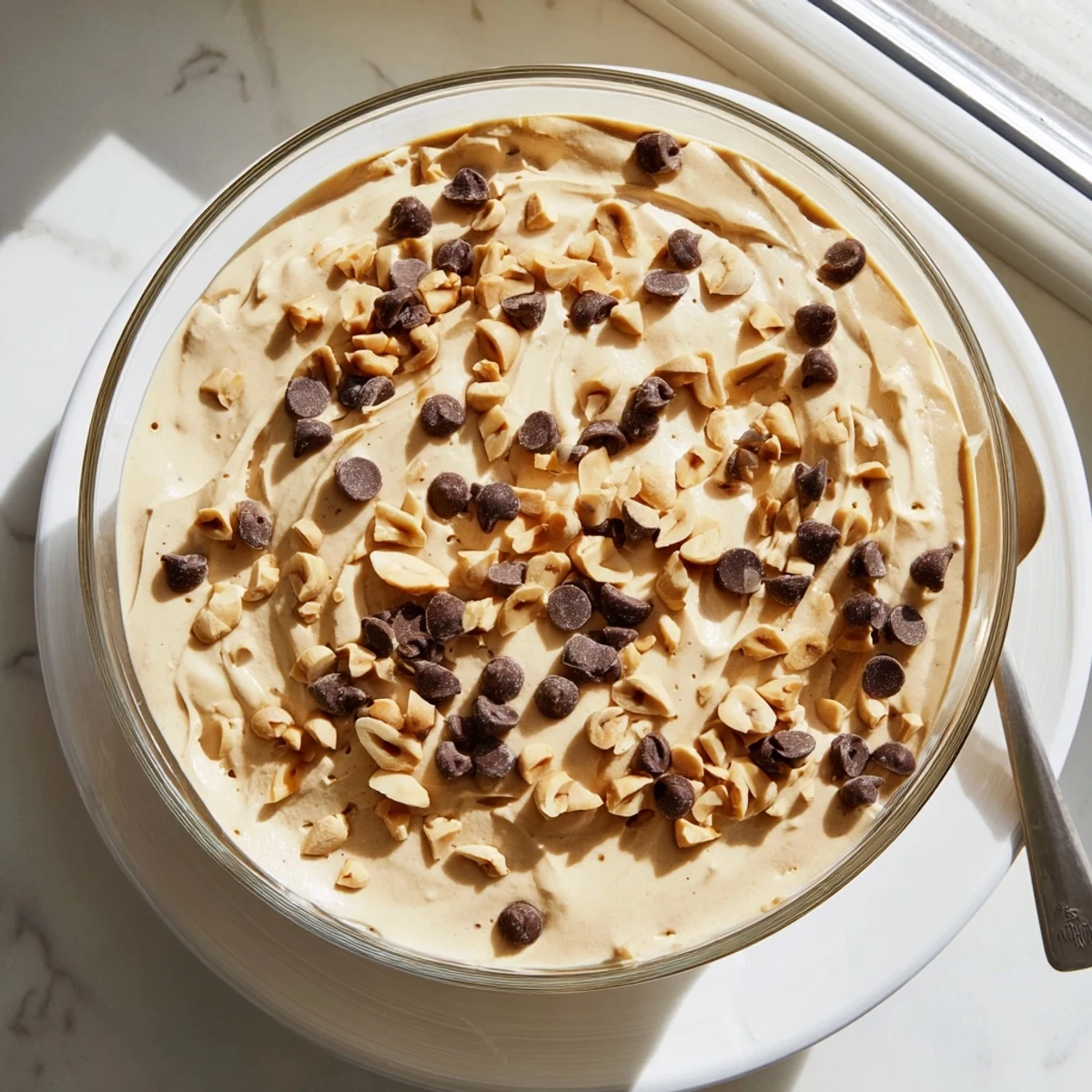 Light and fluffy peanut butter and Cool Whip mousse dessert spooned into elegant serving glasses with a velvety smooth texture