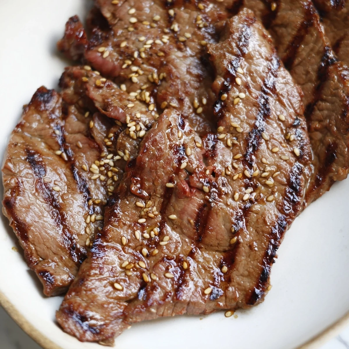 Tender Beef Yakiniku with charred peppers and mushrooms served over fluffy white rice