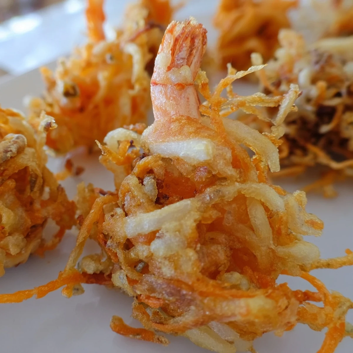 Crispy golden Ukoy Filipino shrimp fritters served with tangy vinegar garlic dipping sauce