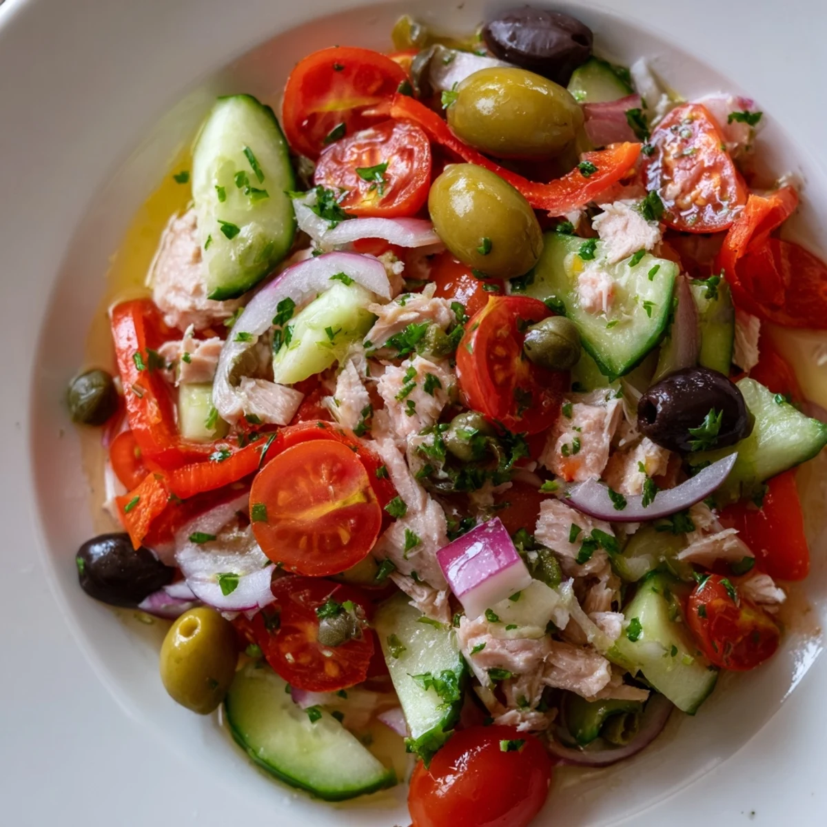 Simple Mediterranean tuna salad topped with Kalamata olives and a bright lemon dressing