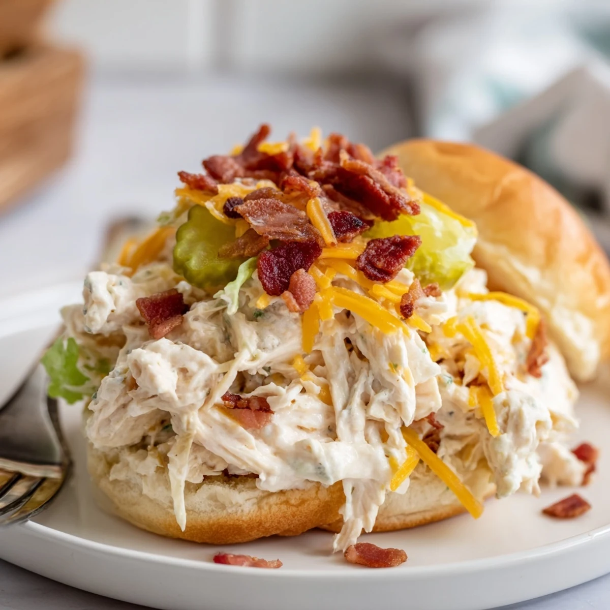 Toasted brioche Crack Chicken Sandwiches served with tangy pickles and lettuce