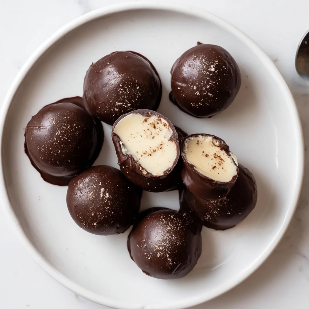 Hand-rolled Dark Chocolate Eggnog Truffles chilled, melt-in-your-mouth center, served with coffee