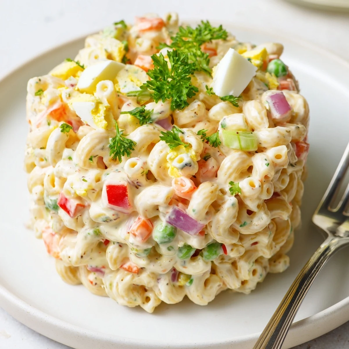 Creamy Macaroni Salad with crisp celery and tangy dressing, chilled for picnics