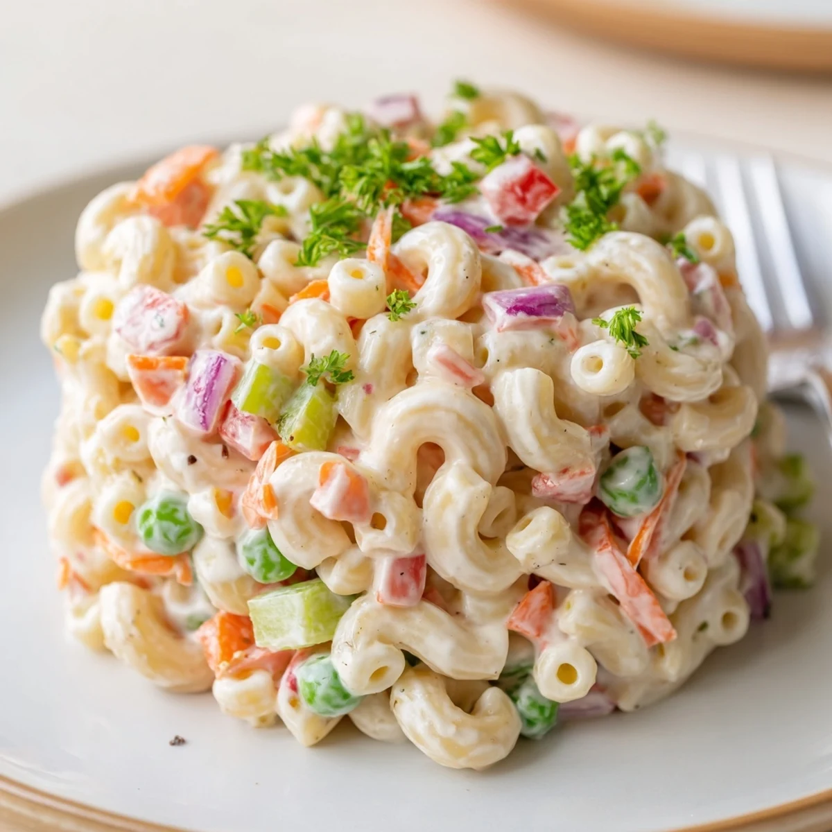 Zesty Macaroni Salad studded with peas, red pepper, perfect potluck side