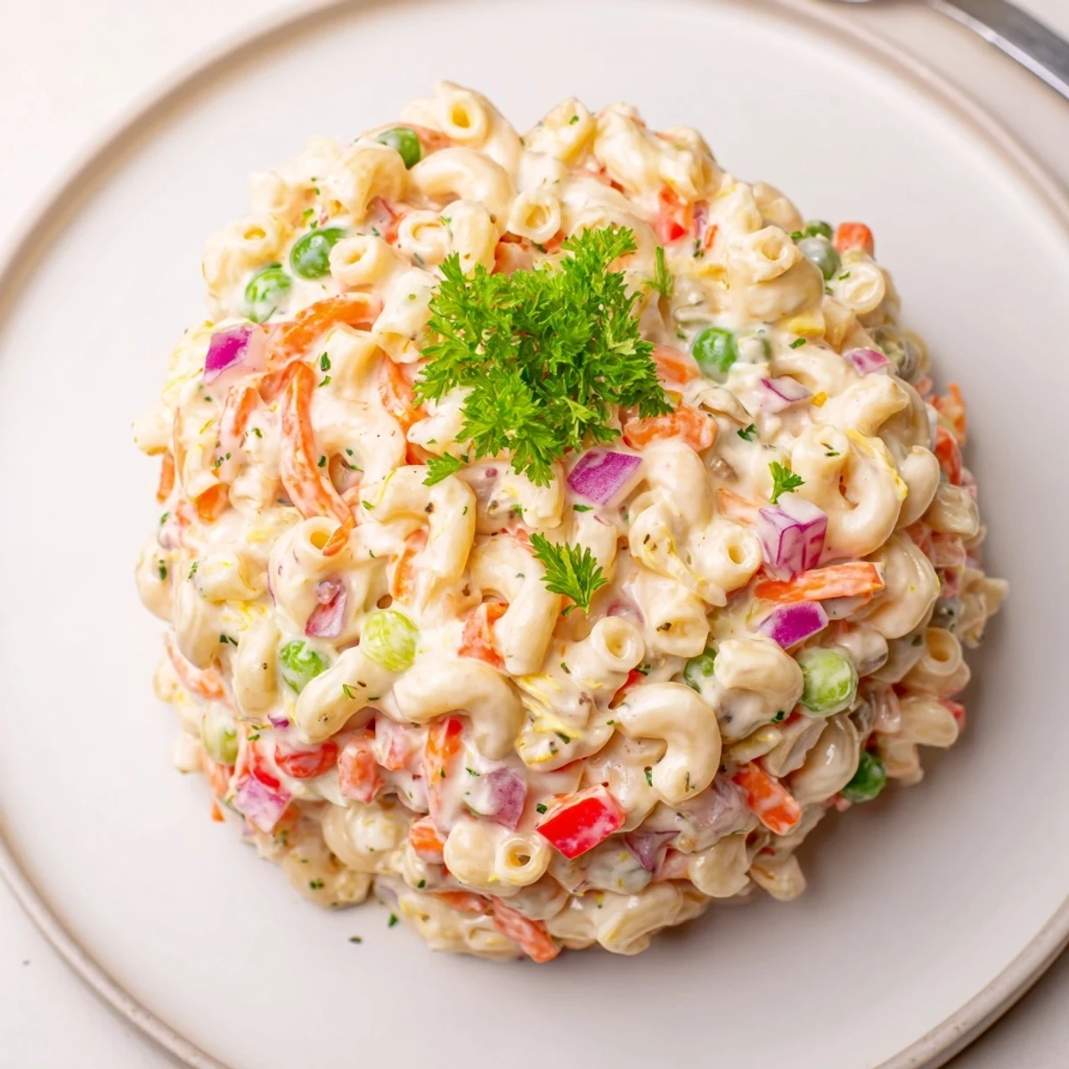 Classic Macaroni Salad tossed in creamy dressing, served chilled alongside grilled meats