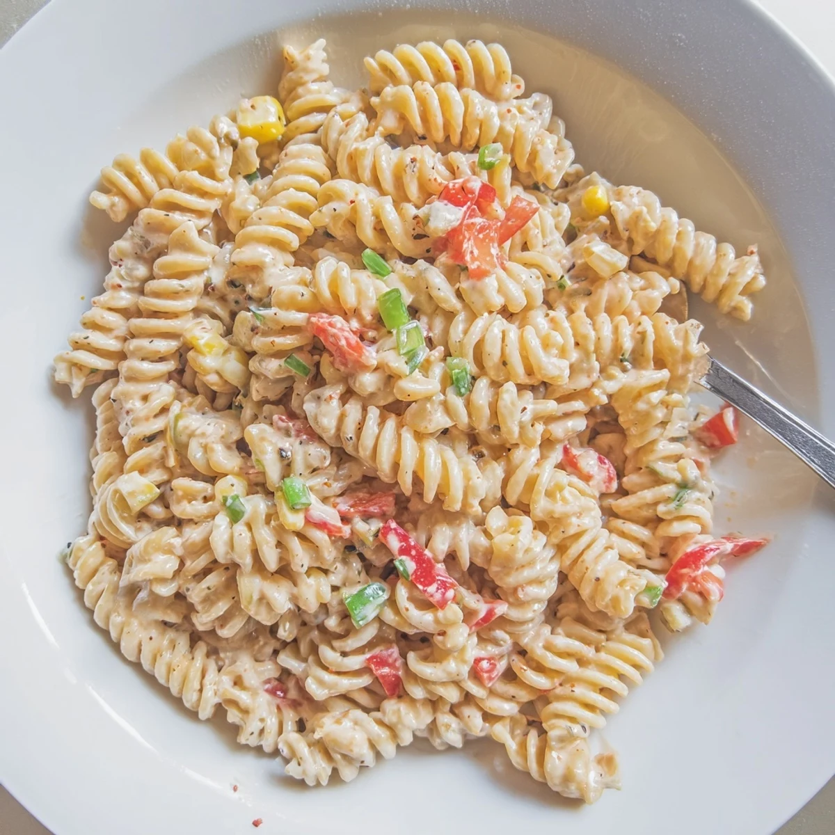 Street Corn Pasta Salad with charred corn, creamy dressing, lime zest
