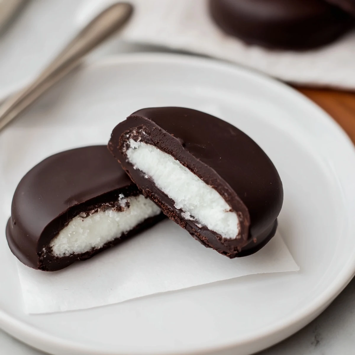 Hand dipped Peppermint Patties resting on a tray, sprinkled with crushed candy