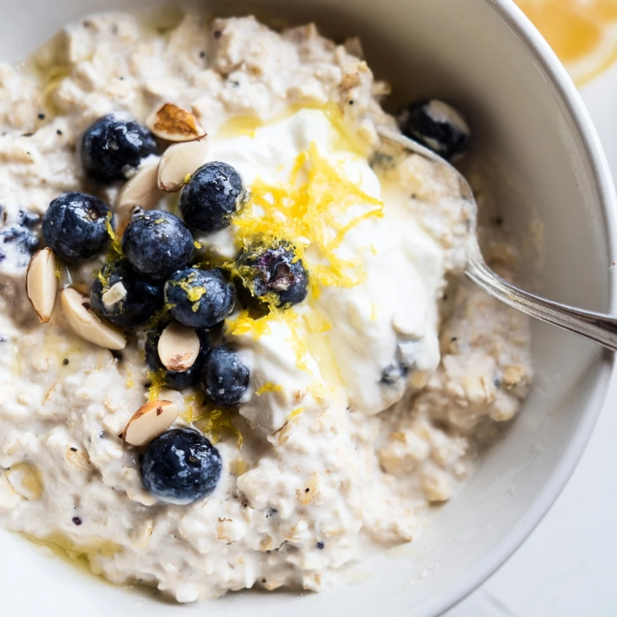 Chilled Blueberry Lemon Overnight Oats topped with crunchy nuts and extra blueberries