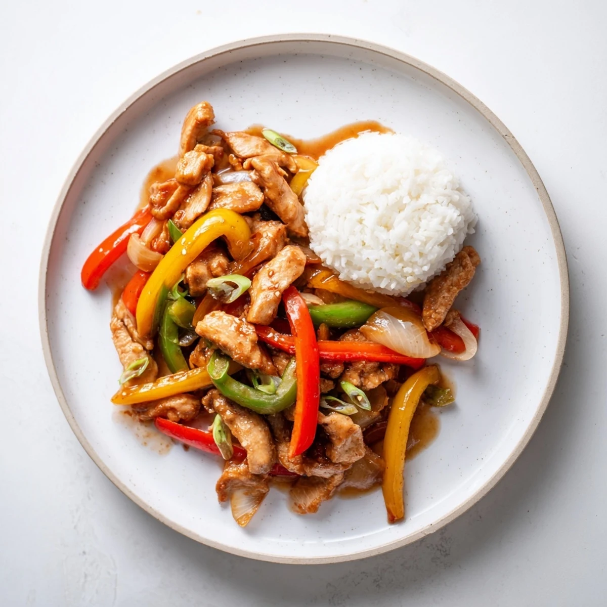 Quick Pepper Chicken Stir Fry sizzling in wok with glossy soy sesame sauce
